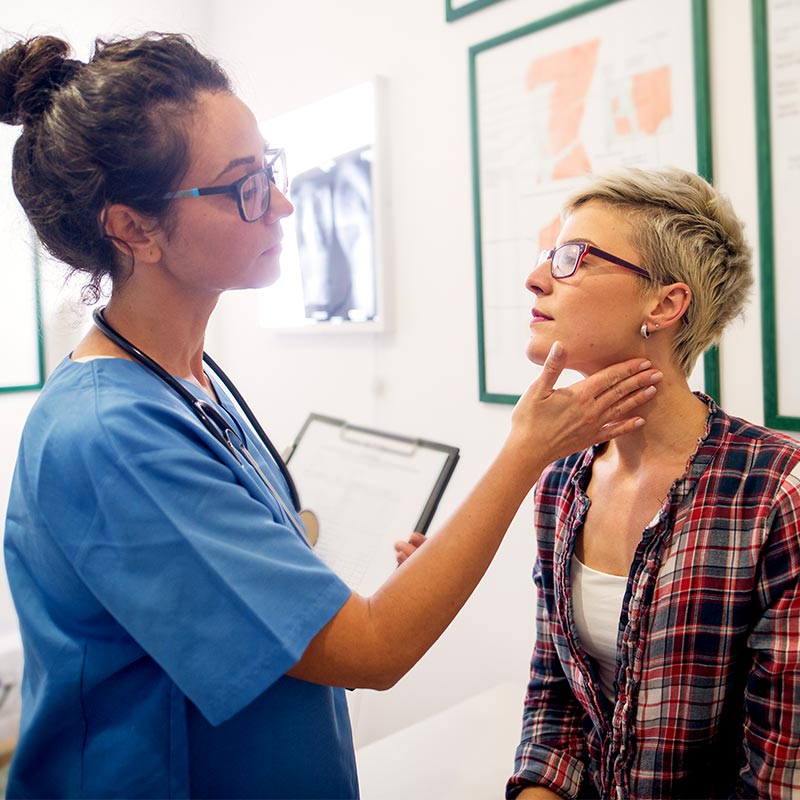 A doctor examining a patient