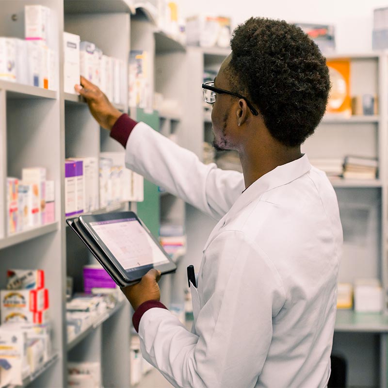 A pharmacist checking stock