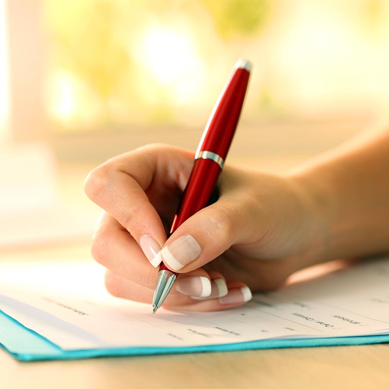 A woman filling out forms